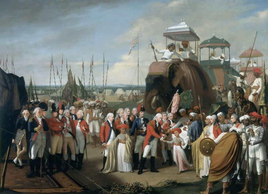 Cérémonie historique avec éléphant, officiers militaires portants des chino et individus en tenue traditionnelle indienne près d’un port.